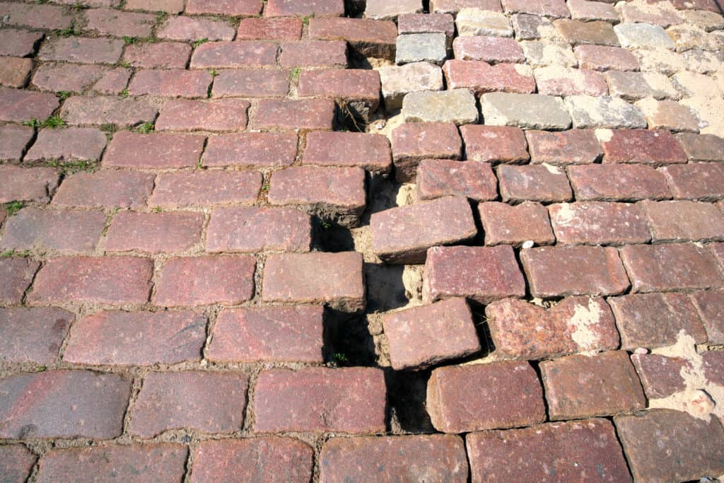 Relocation of granite pavers. Road restoration. Relocation of granite pavers. Road restoration.