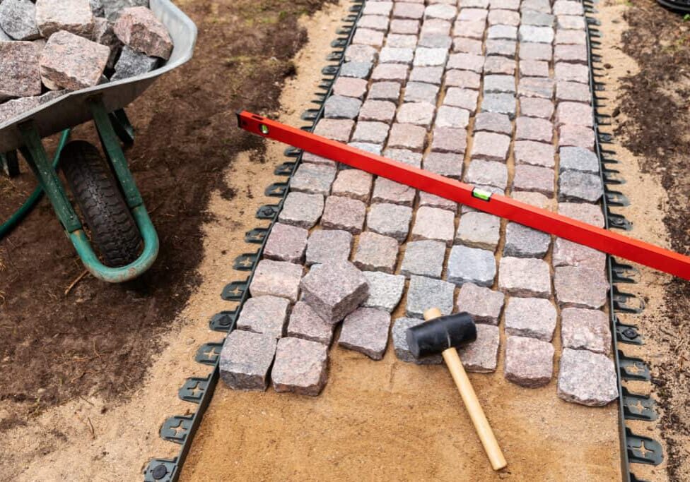 landscaping and garden services - granite cobblestone walkway construction